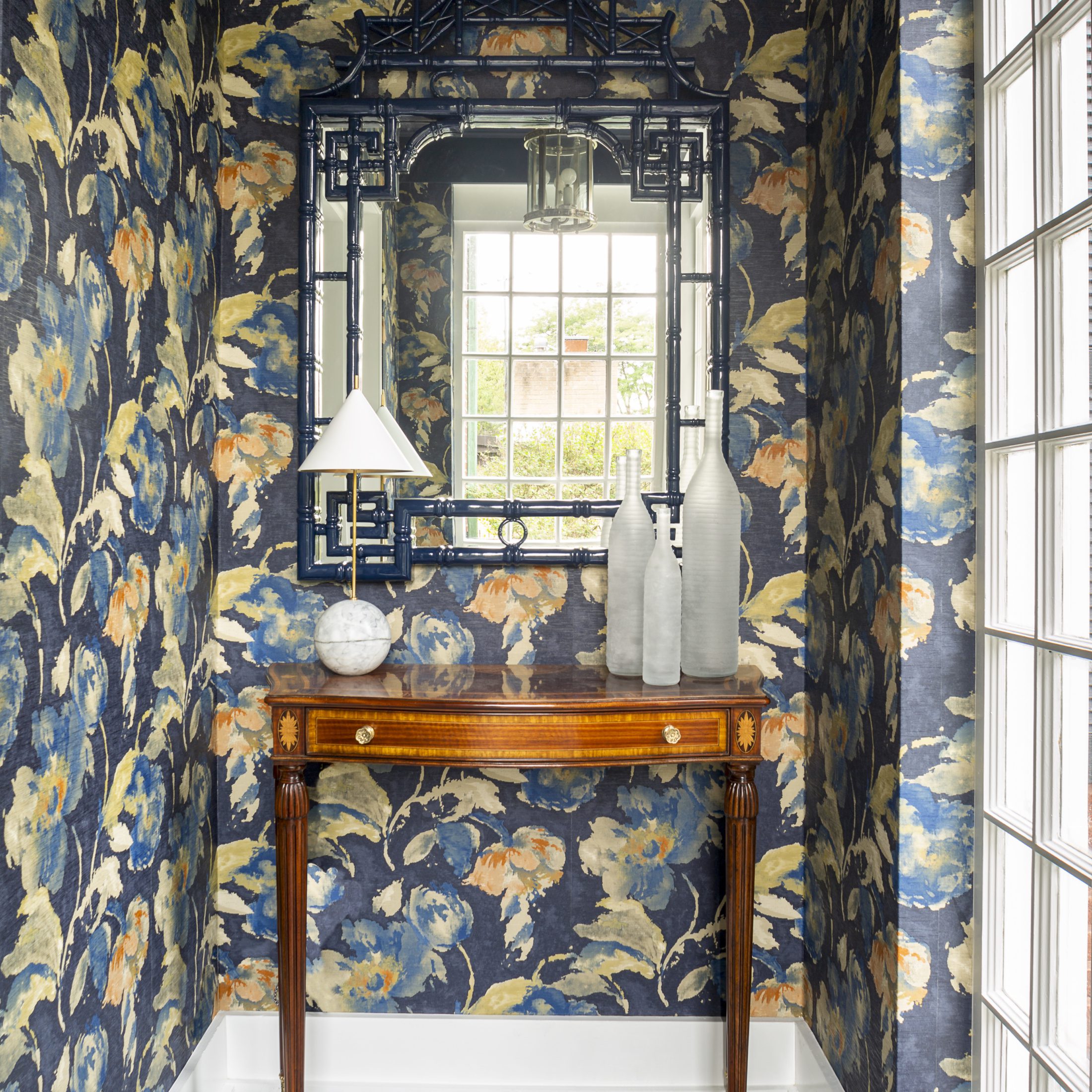 Glencoe wooden side table with navy blue floral wallpaper