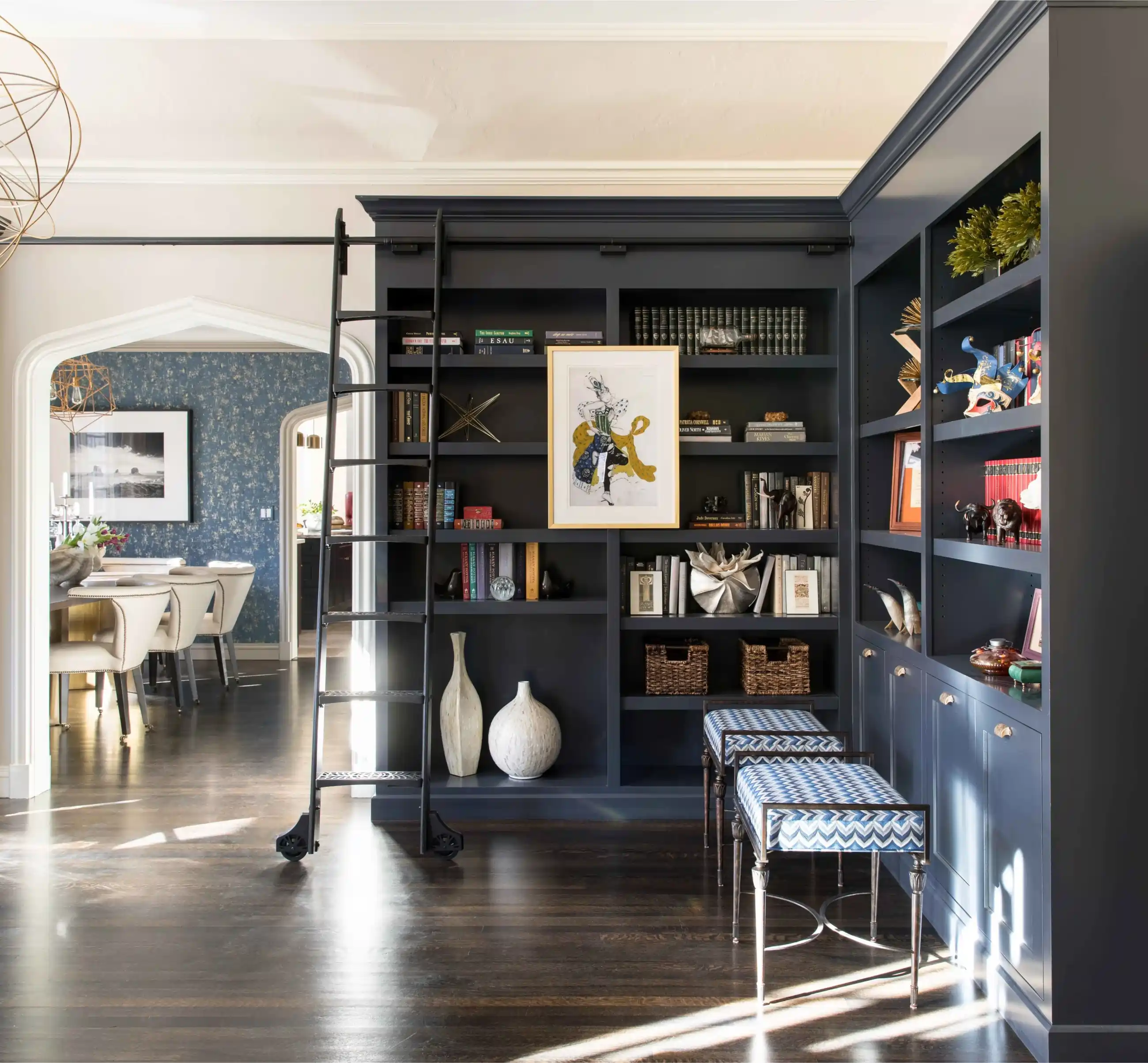 Custom built in shelving with dark painted cabinetry in a Cherry Hills Village home